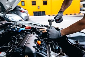 Mechanic,Using,Wrench,While,Working,On,Car,Engine,At,Garage - Meineke California Meineke Car Care | Engine | Martinez CA